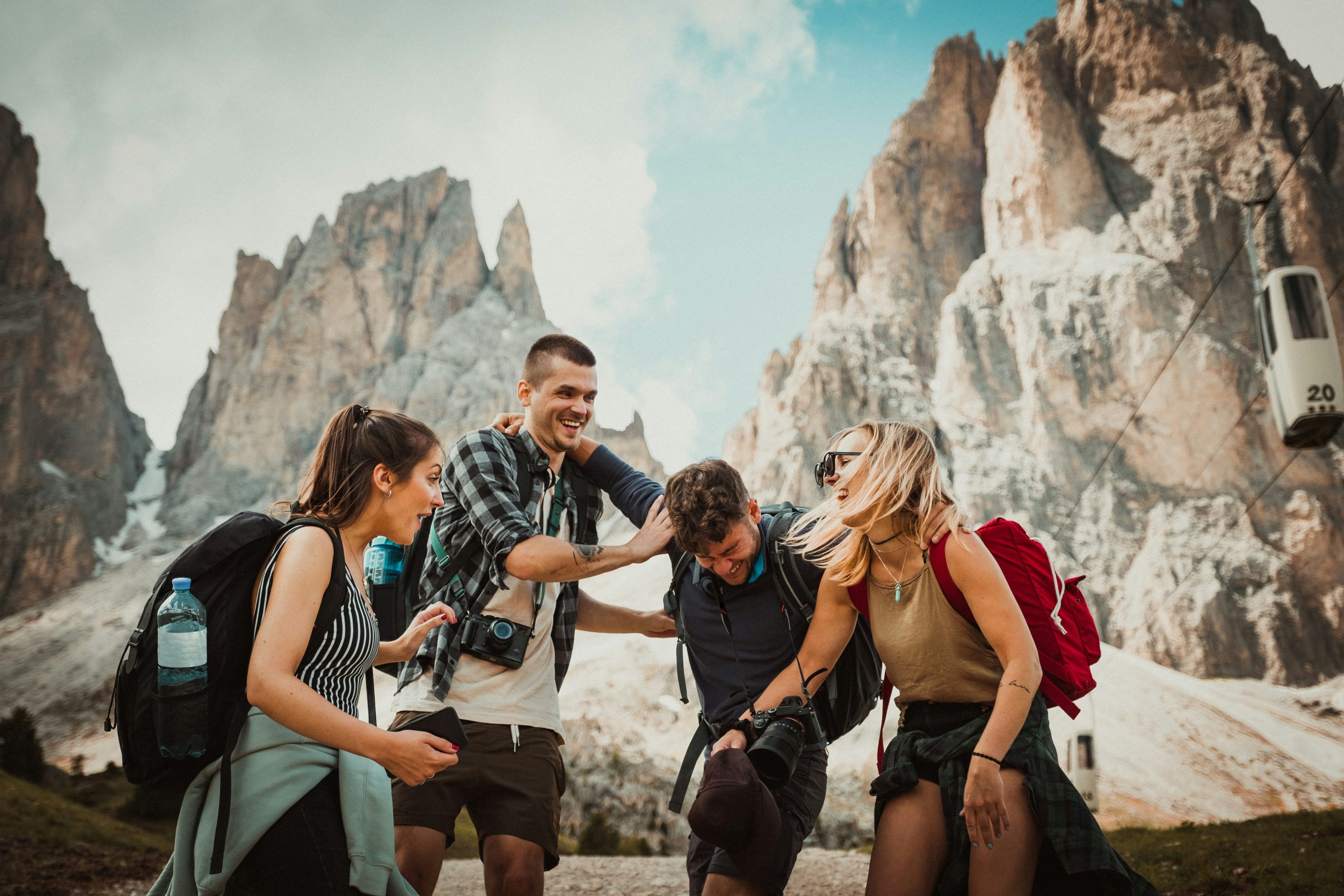 low-angle-photography-of-two-men-playing-beside-two-women